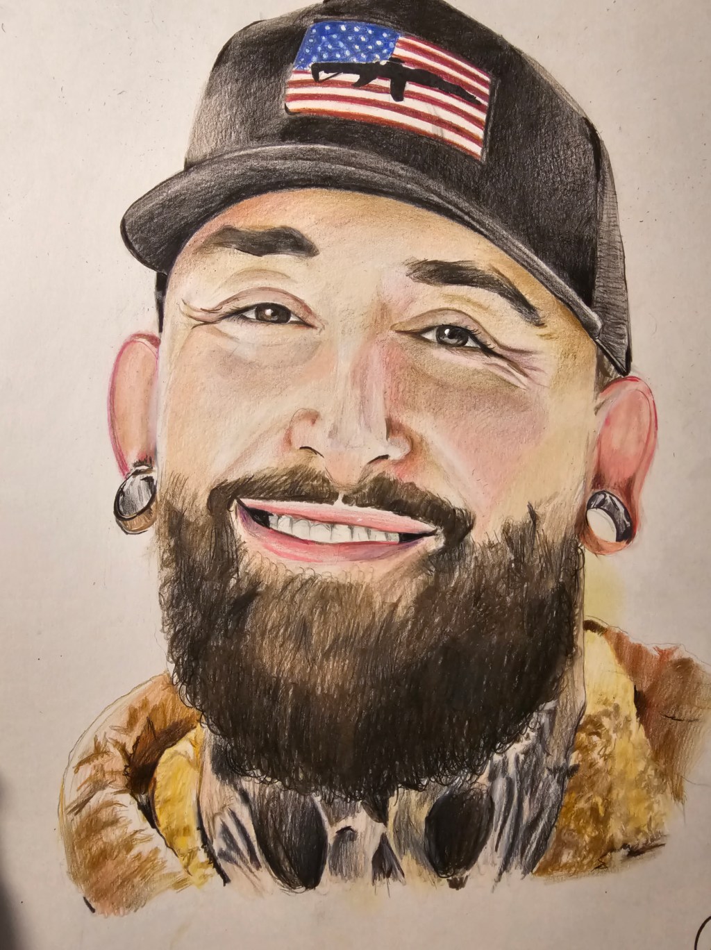 Colored-pencil portrait of a smiling bearded man wearing a black cap with an American flag patch.
